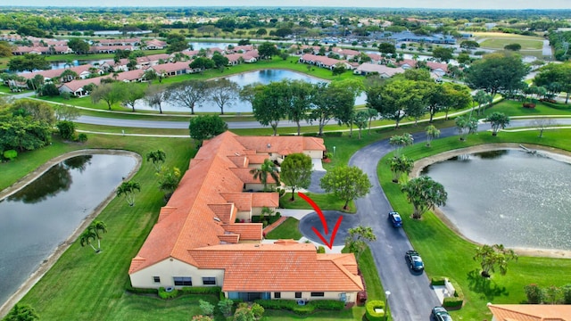 aerial view with a water view and a residential view