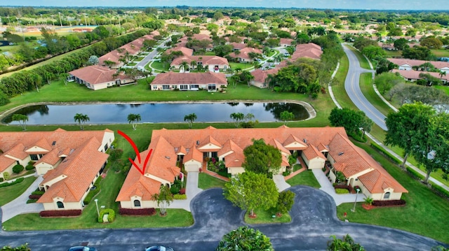 aerial view with a water view and a residential view