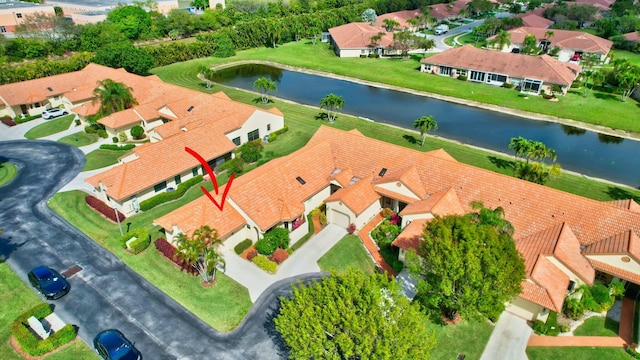 birds eye view of property with a residential view and a water view