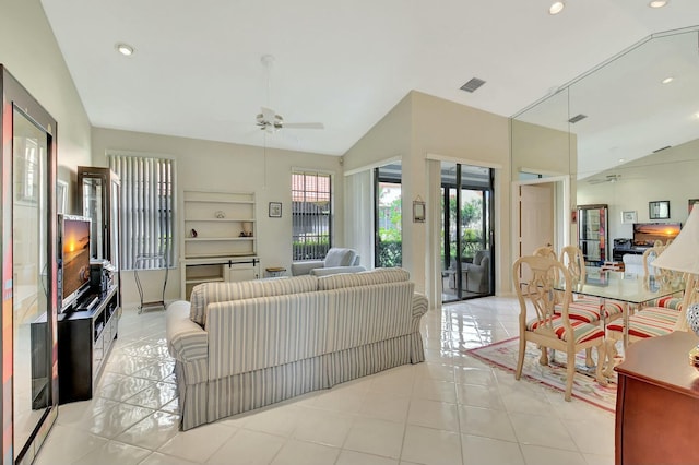 living room with light tile patterned floors, recessed lighting, a ceiling fan, visible vents, and vaulted ceiling