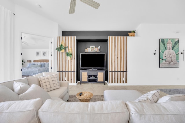 living room featuring ceiling fan and tile patterned flooring