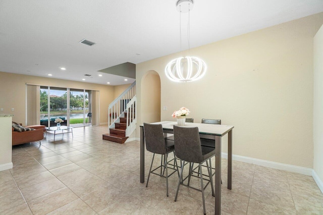 dining room featuring a chandelier, recessed lighting, visible vents, baseboards, and stairway