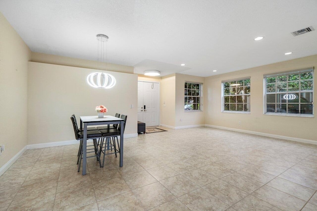 dining area with recessed lighting, visible vents, and baseboards