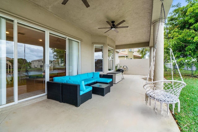 view of patio / terrace featuring a ceiling fan, outdoor lounge area, and fence