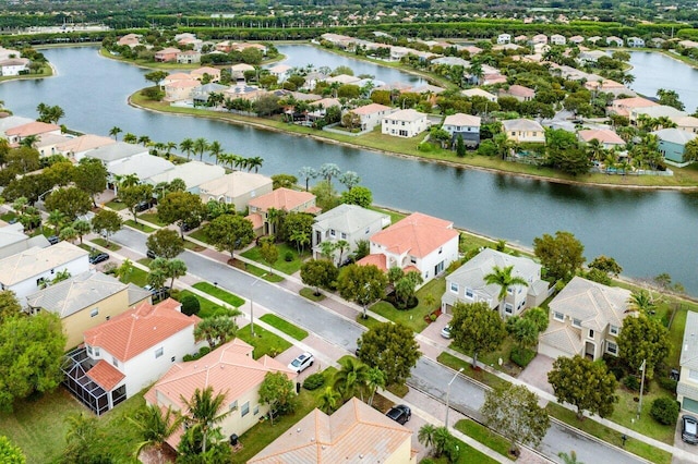 drone / aerial view with a residential view and a water view