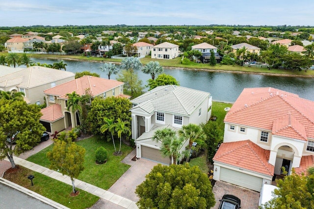 drone / aerial view featuring a water view and a residential view