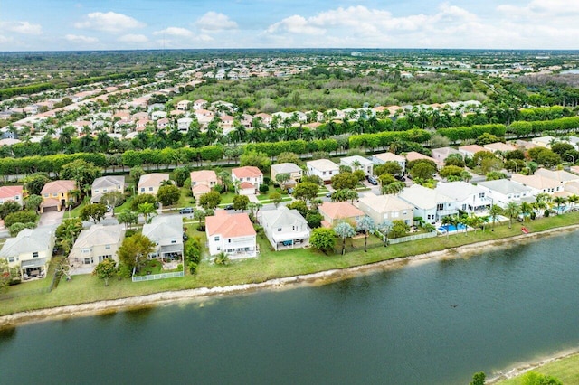 birds eye view of property featuring a residential view and a water view