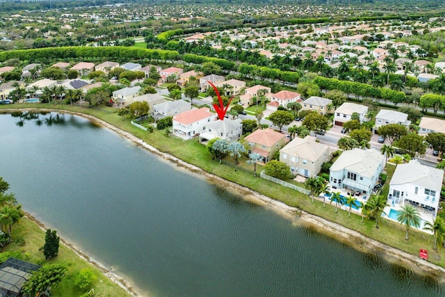 drone / aerial view with a residential view and a water view