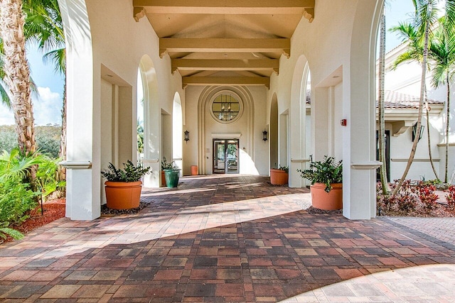 property entrance with stucco siding