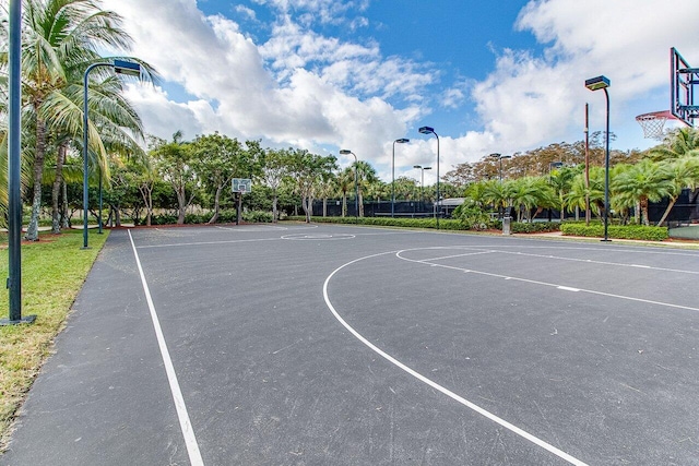 view of basketball court with community basketball court and fence