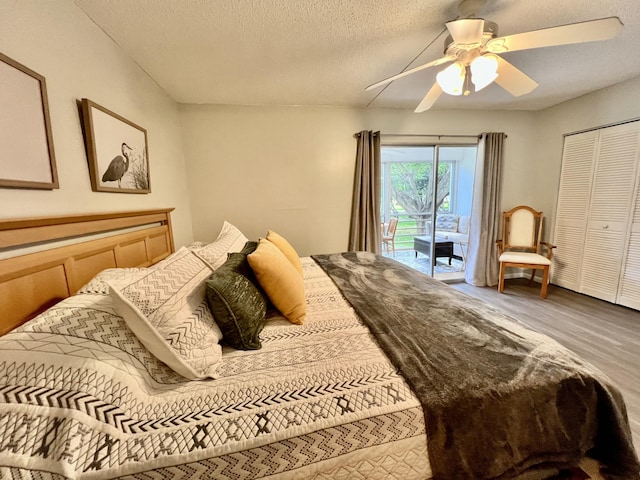 2014 Cambridge A, Deerfield Beach, FL 33442 - bedroom featuring ceiling fan, wood finished floors, a textured ceiling, and access to exterior