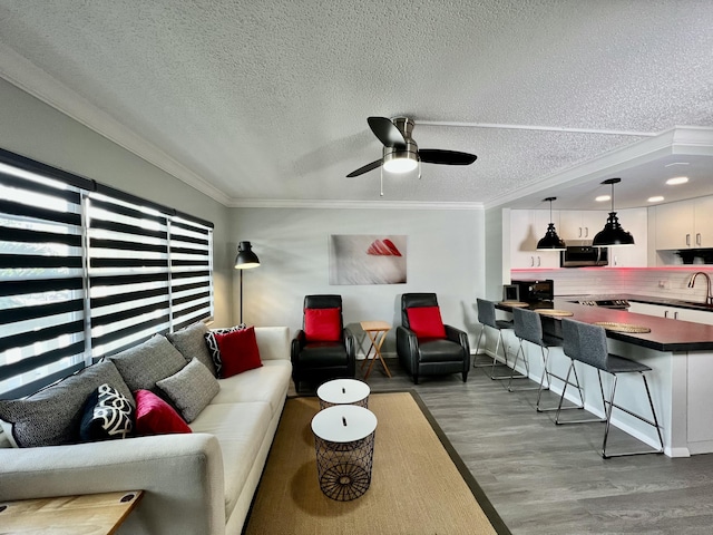 2014 Cambridge A, Deerfield Beach, FL 33442 - living area with a textured ceiling, crown molding, a ceiling fan, and wood finished floors