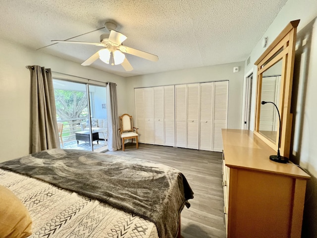 bedroom with ceiling fan, a textured ceiling, wood finished floors, and access to exterior