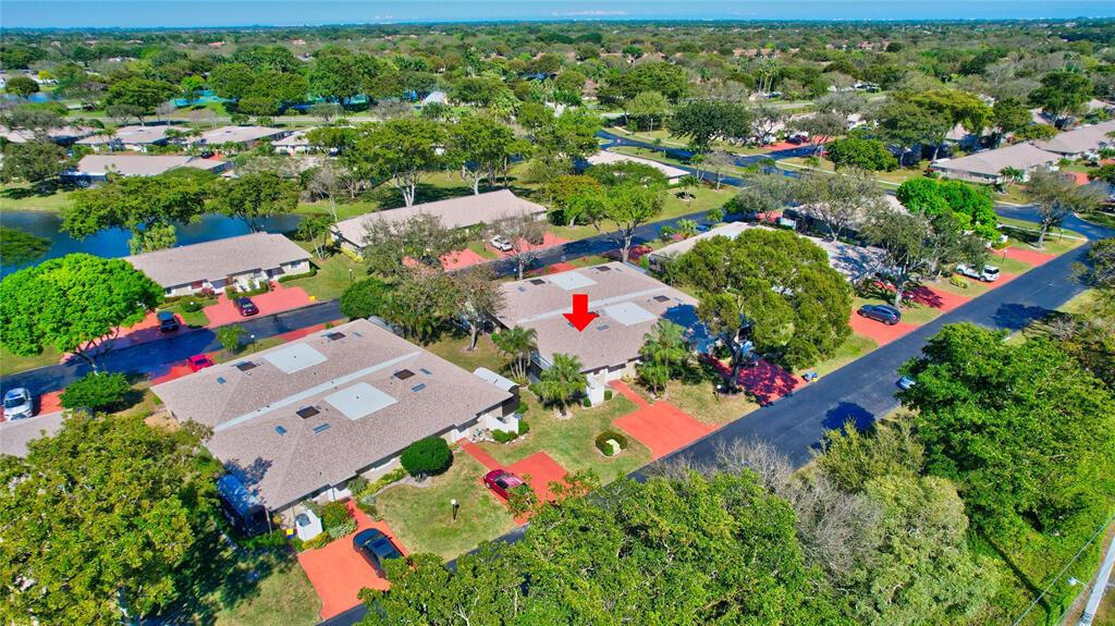 bird's eye view featuring a water view and a residential view