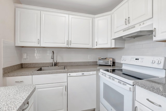 kitchen featuring white appliances, under cabinet range hood, white cabinetry, and a sink