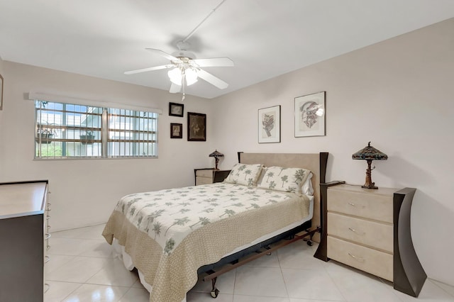 bedroom with a ceiling fan and light tile patterned floors