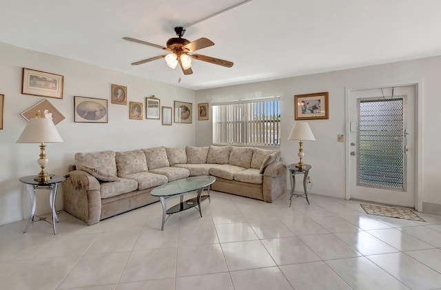 living room with a ceiling fan and light tile patterned flooring