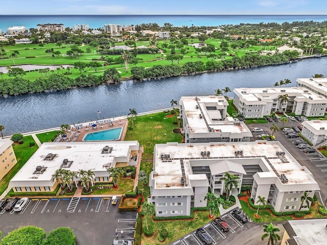 aerial view with a water view and golf course view