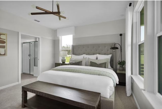 bedroom with light colored carpet, visible vents, ensuite bathroom, a ceiling fan, and baseboards