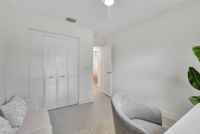 office featuring concrete floors, visible vents, and baseboards