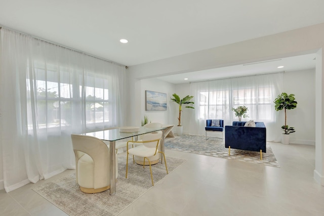 dining area with baseboards and recessed lighting