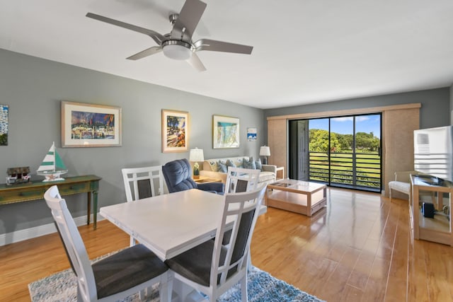 dining space featuring ceiling fan, wood finished floors, and baseboards