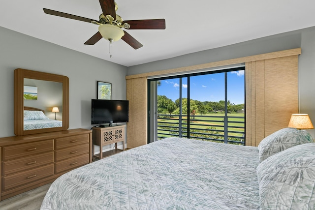 bedroom featuring access to exterior, ceiling fan, and wood finished floors