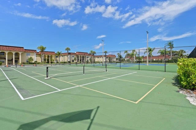 view of tennis court with fence