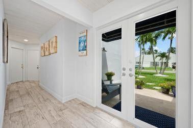 interior space with light wood finished floors and baseboards