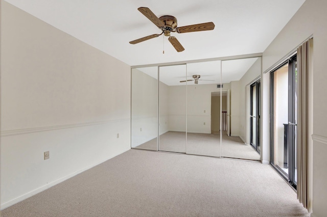 unfurnished bedroom featuring light carpet and ceiling fan