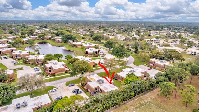 birds eye view of property featuring a water view and a residential view