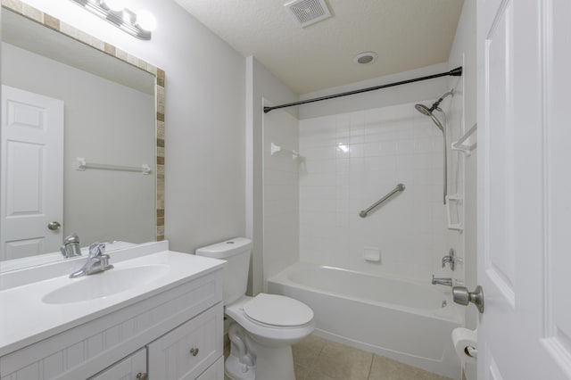 bathroom featuring a textured ceiling, tile patterned flooring, toilet, vanity, and visible vents