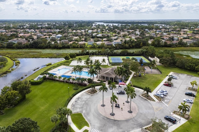 bird's eye view featuring a water view and a residential view