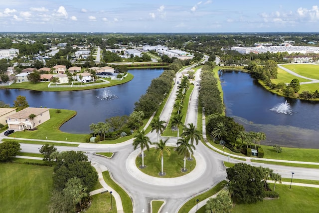 drone / aerial view with a residential view and a water view