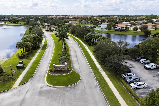 aerial view featuring a water view and a residential view