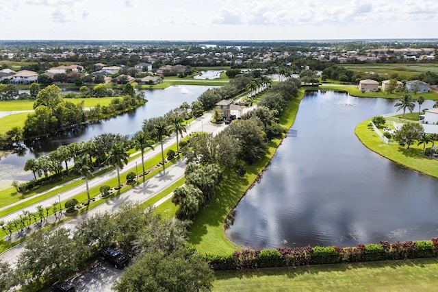 birds eye view of property featuring a residential view and a water view