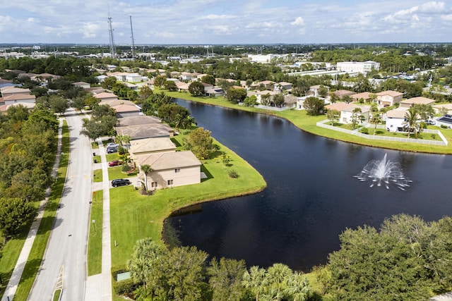 birds eye view of property with a water view and a residential view