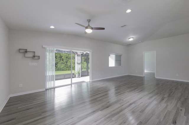 spare room featuring ceiling fan, recessed lighting, wood finished floors, and baseboards