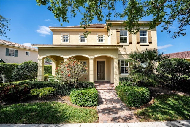 view of front of house with covered porch and stucco siding