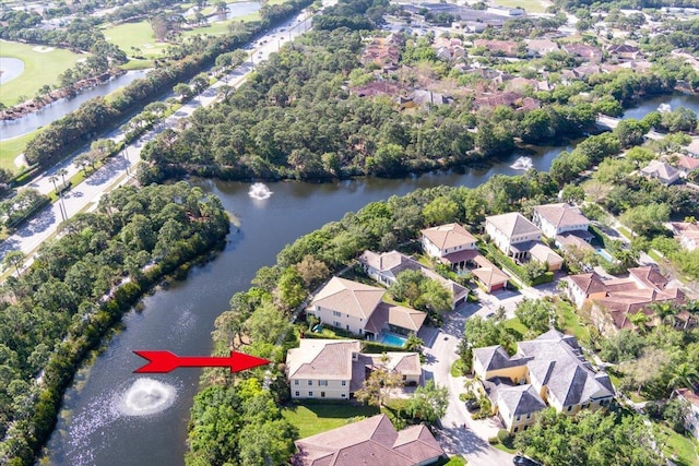 drone / aerial view with a water view and a residential view