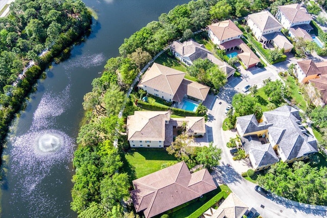 birds eye view of property featuring a residential view and a water view