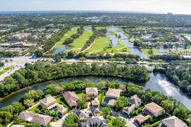 birds eye view of property with a water view and a residential view