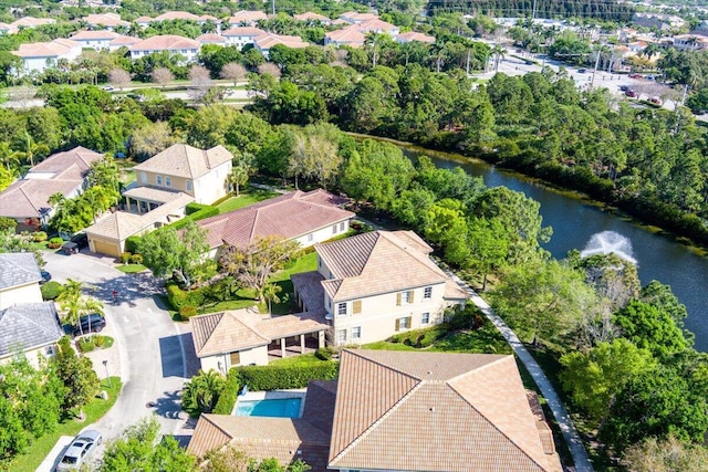 birds eye view of property featuring a water view and a residential view