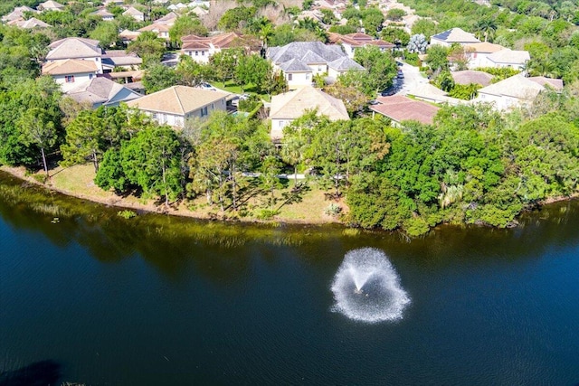 drone / aerial view with a water view and a residential view