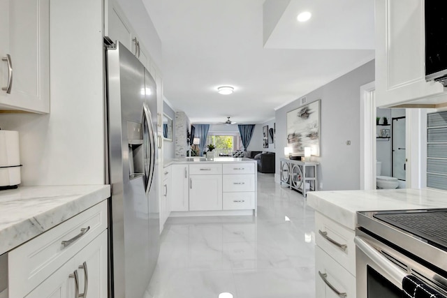 kitchen featuring stainless steel appliances and white cabinets