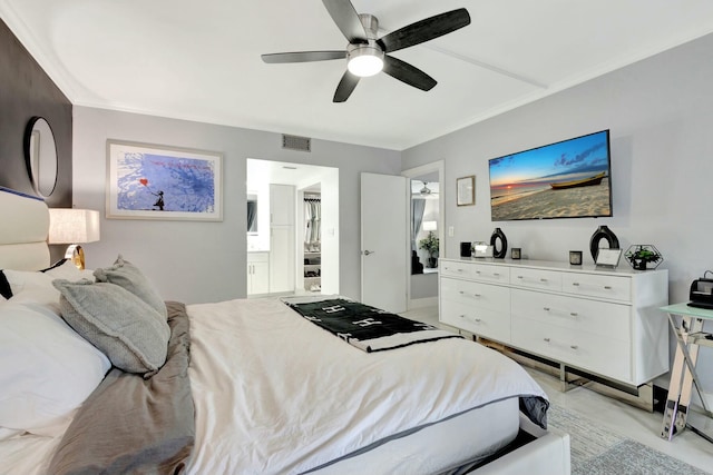 bedroom with crown molding, connected bathroom, visible vents, and a ceiling fan