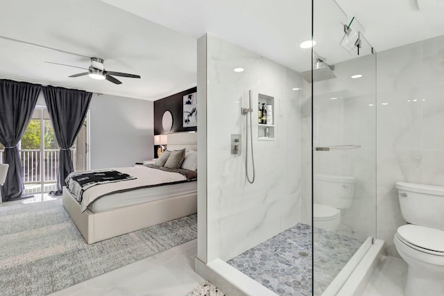 ensuite bathroom with connected bathroom, toilet, tile walls, a ceiling fan, and a marble finish shower