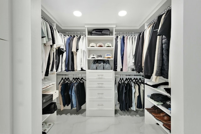 spacious closet featuring marble finish floor