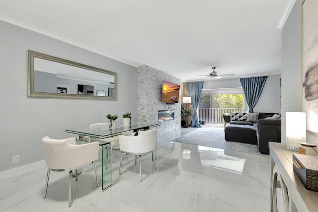 dining room featuring ornamental molding, marble finish floor, and a fireplace