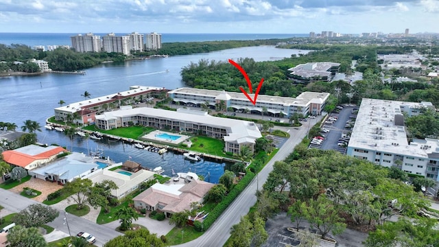 birds eye view of property featuring a water view